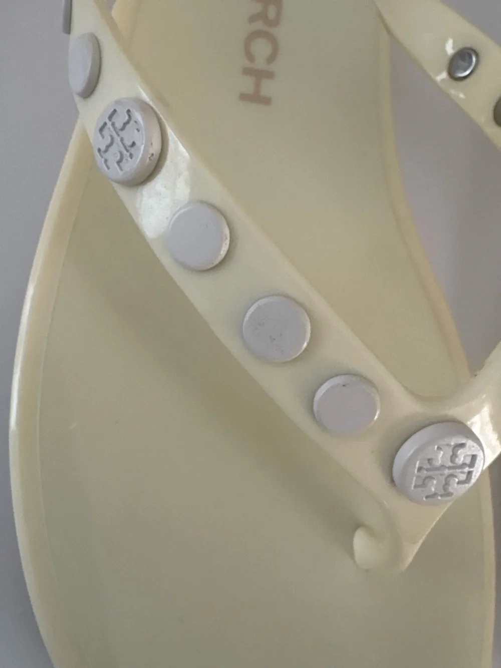Tory Burch Ivory/pale yellow thong jelly  sandals size 7. Studded w/metal logos